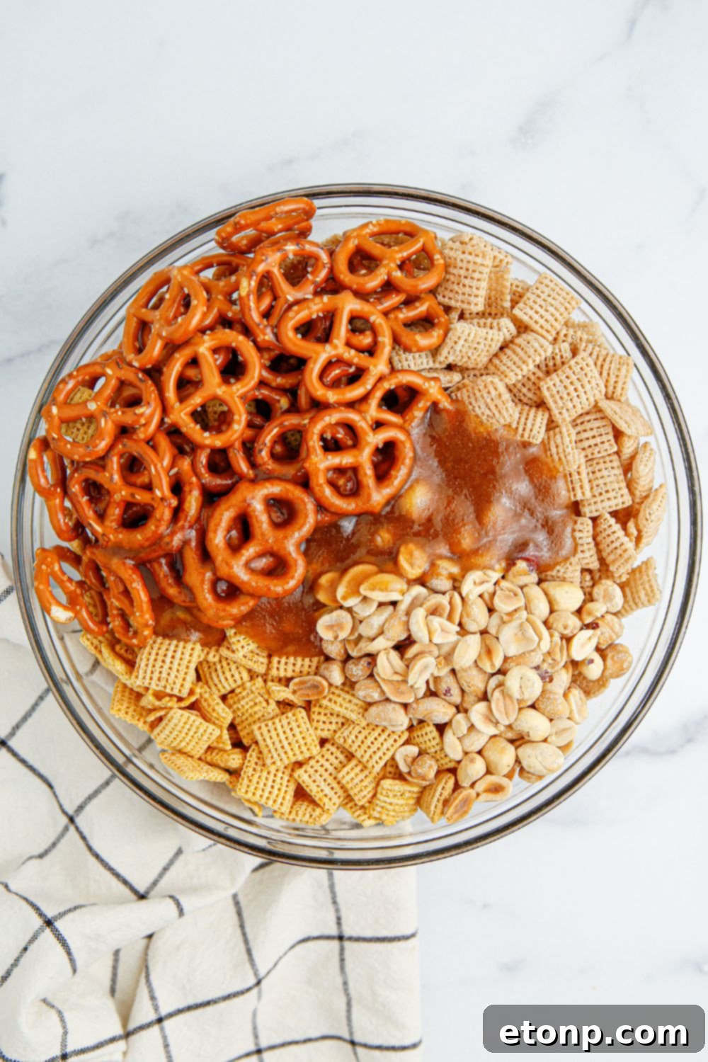 A cereal bowl containing the buttery cinnamon-sugar mixture, gleaming and ready to be combined with the dry ingredients.