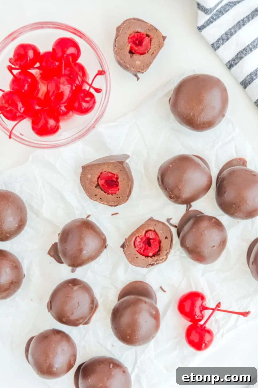 Fudgy Cherry Chocolate Bombs 17 Cherry Brownie Bombs on table with bowl of cherries on side