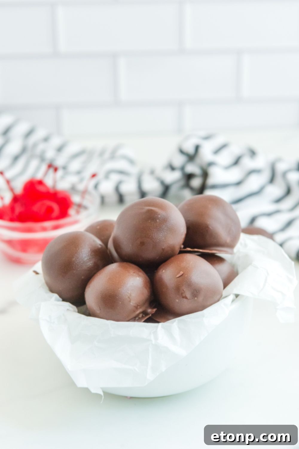 Fudgy Cherry Chocolate Bombs 21 cherry brownie truffles in a bowl on table
