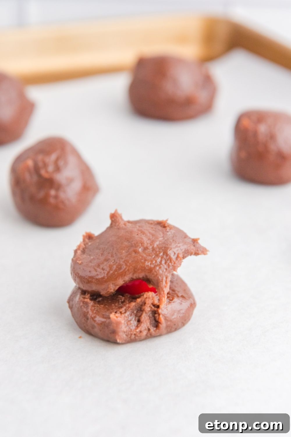 Fudgy Cherry Chocolate Bombs 10 brownie batter with a cherry in center of ball