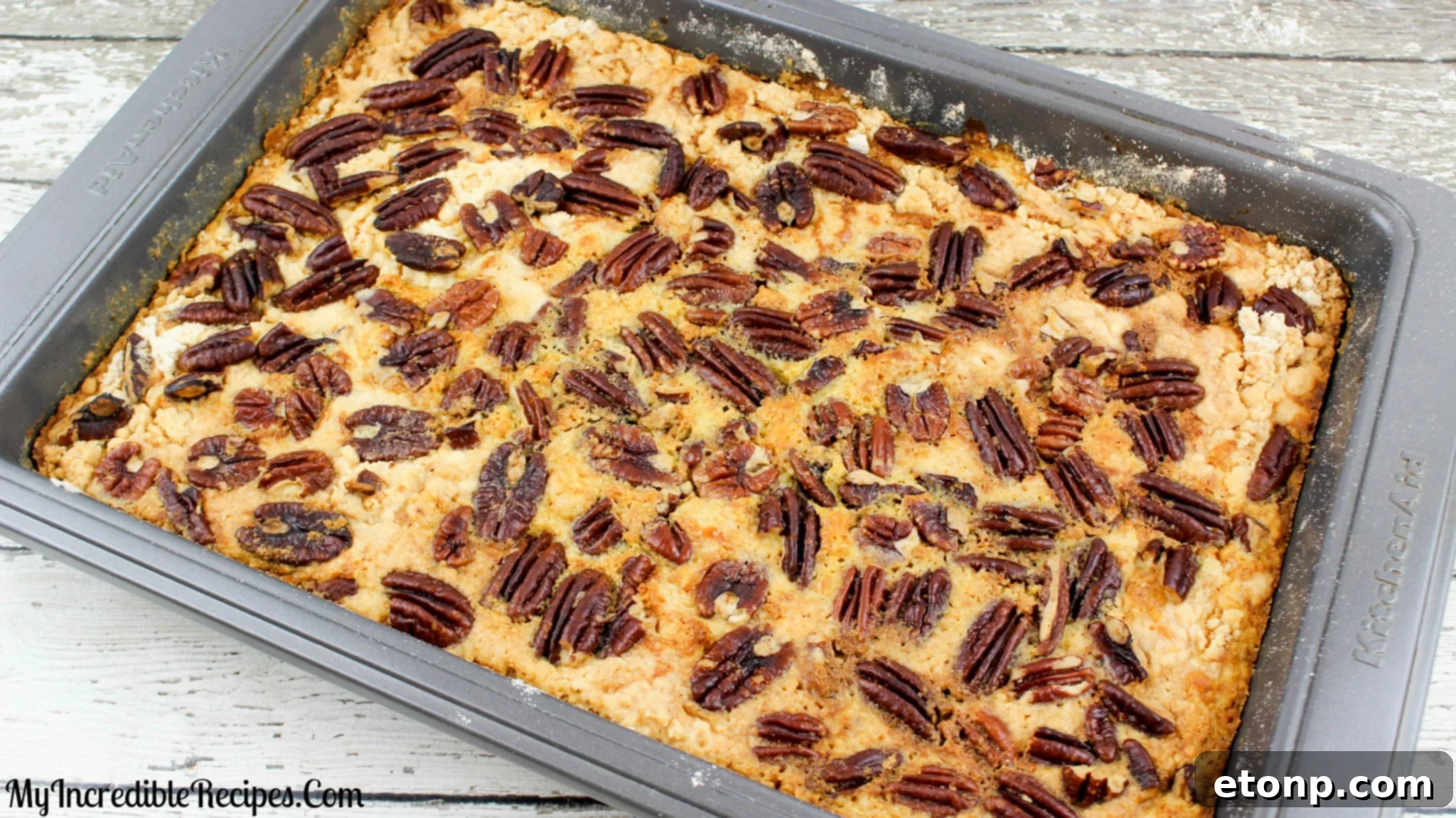 Simply Divine Pumpkin Pecan Dump Cake 11 A close-up shot of the toasted pecans on the top layer of the cake, perfectly browned.