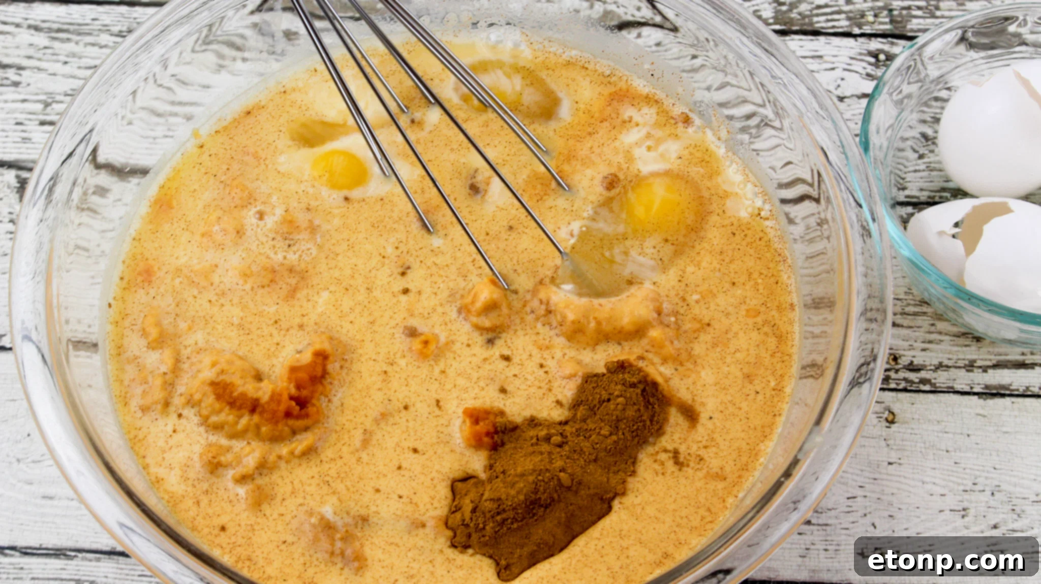 Simply Divine Pumpkin Pecan Dump Cake 4 Close-up of the pecan topping on the dump cake, glistening with melted butter and cinnamon sugar.