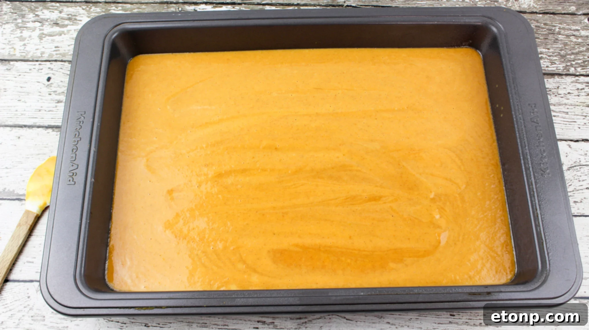 Simply Divine Pumpkin Pecan Dump Cake 6 Corner slice of Pumpkin Pecan Dump Cake, highlighting the distinct layers: pumpkin, cake, and pecan crust.