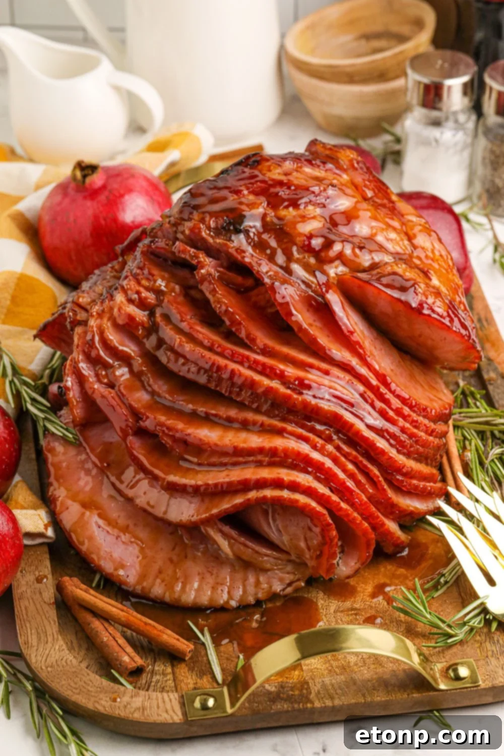 Dr. Pepper Glazed Ham 11 sliced ham on table with forks on edge of cutting board