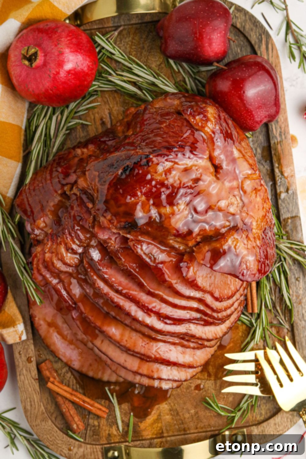 Dr. Pepper Glazed Ham 15 Dr. Pepper Ham side overhead view of it on a serving tray with pomemegranate and apple on side