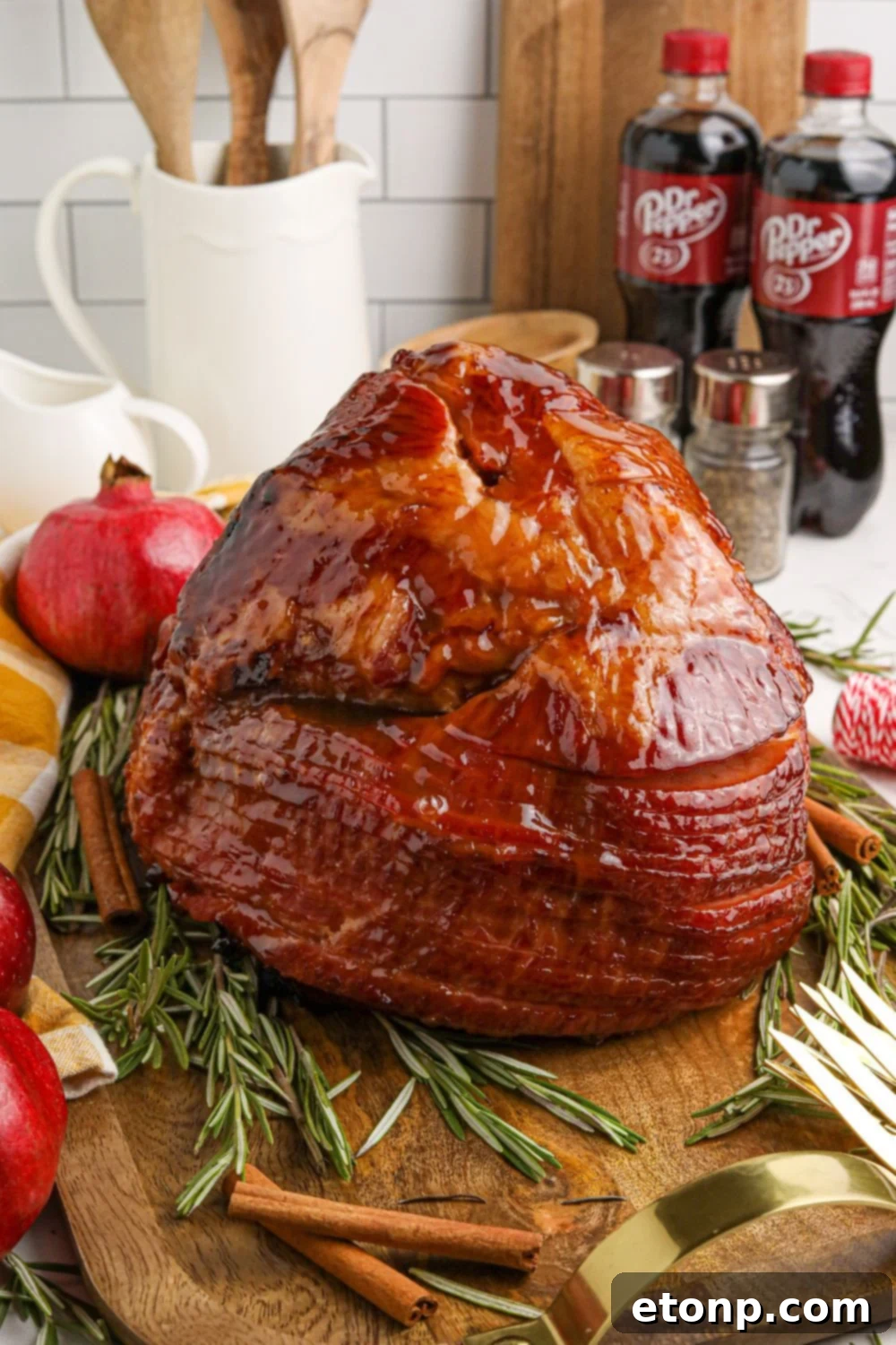 Dr. Pepper Glazed Ham 17 cooked and glazed ham on table with bottles of dr pepper behind it on table