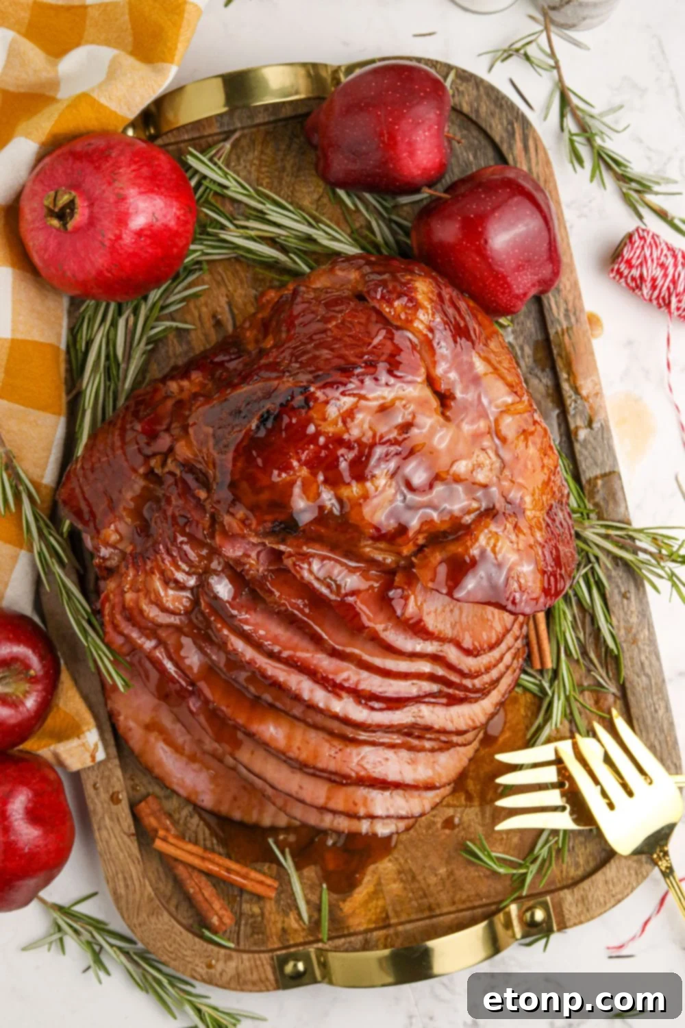 Dr. Pepper Glazed Ham 18 Dr. Pepper Ham on a cutting board with garnish around it