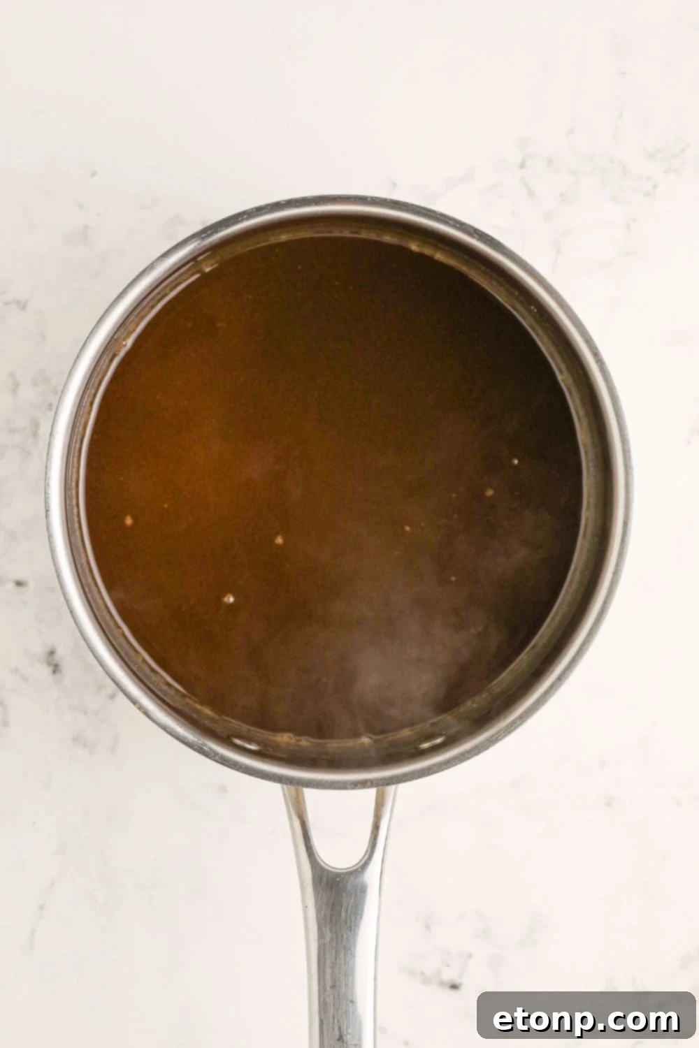 Dr. Pepper Glazed Ham 5 dr pepper glaze in a saucepan