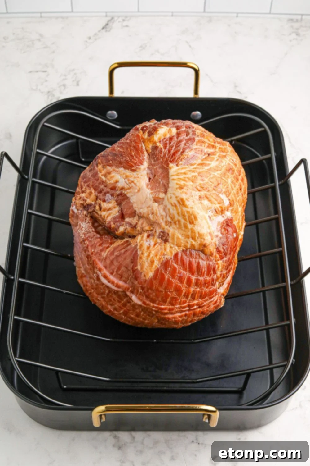 Dr. Pepper Glazed Ham 6 spiral ham sitting on roasting pan