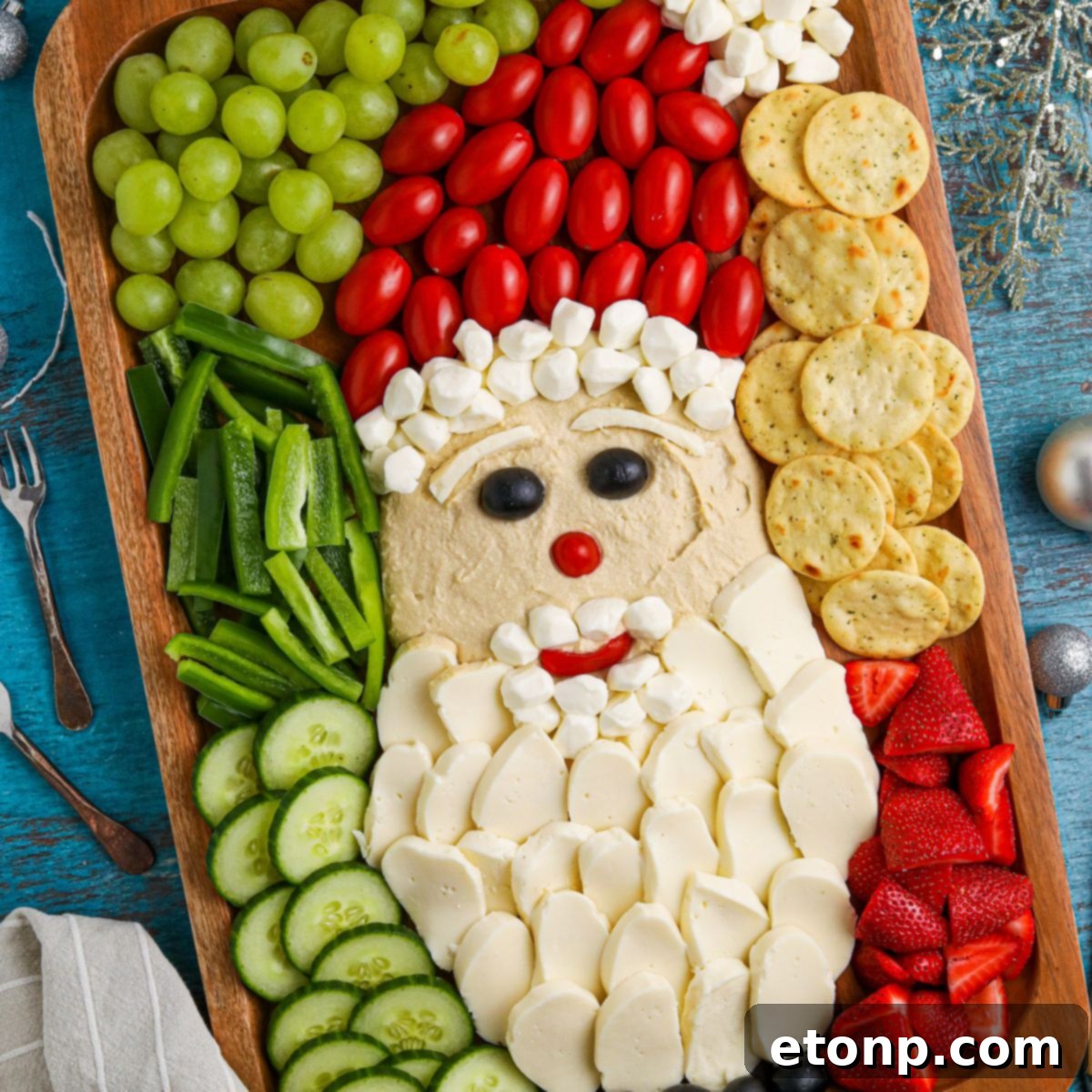 Overhead view of a beautifully arranged Santa Snack Board, showcasing the festive design and fresh ingredients.