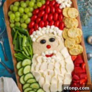 Overhead view of a beautifully arranged Santa Snack Board, showcasing the festive design and fresh ingredients.