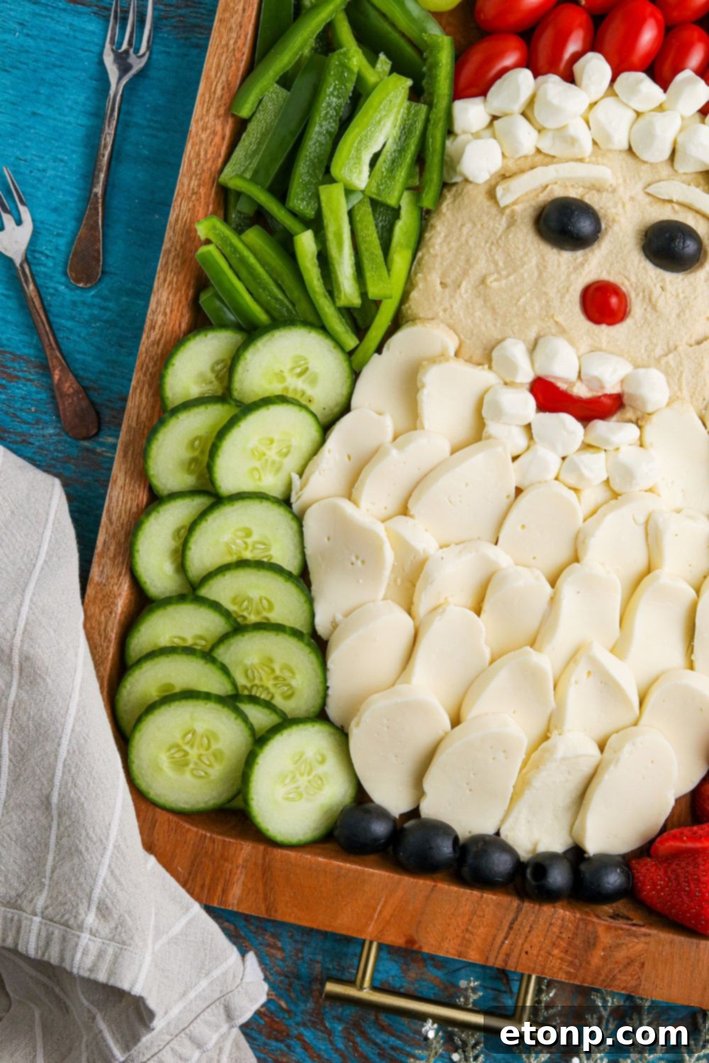 A beautiful side view of the Santa Snack Board on a serving tray, showing its depth and abundance.