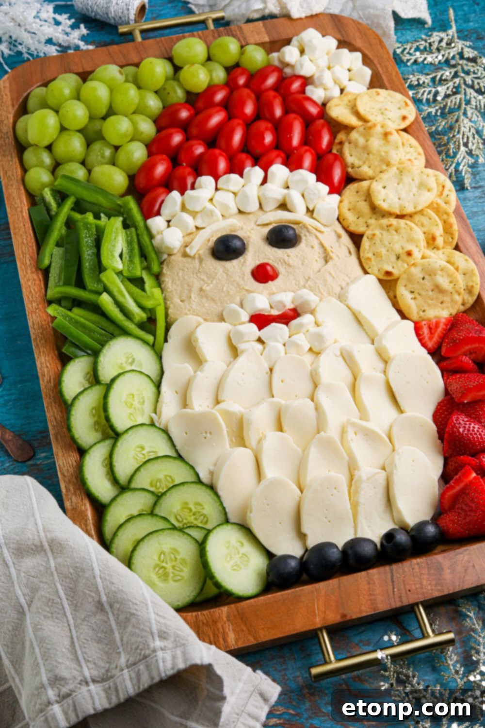 A wide shot of the Santa Claus charcuterie board from a slight angle, highlighting its cheerful arrangement.