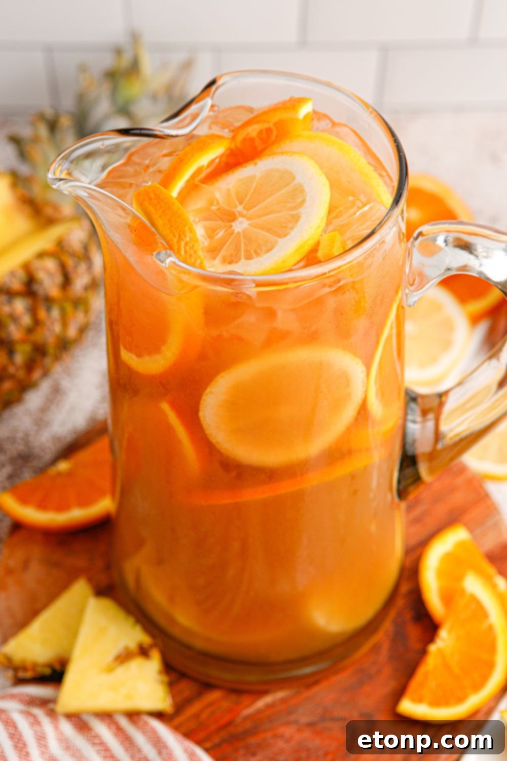 Bourbon iced tea in a pitcher on a rustic table