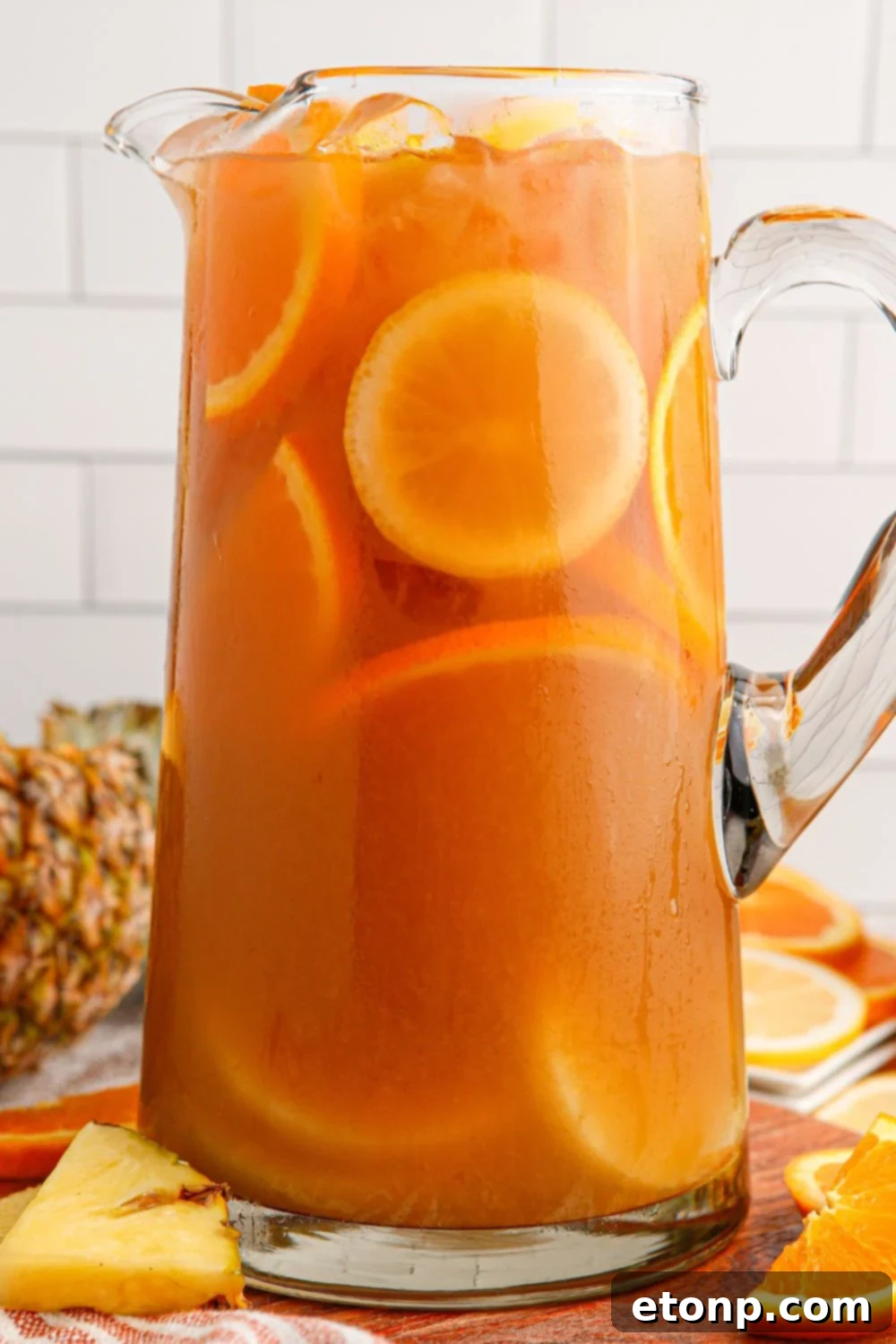 Touchdown Tea in a pitcher with fruit slices inside the container
