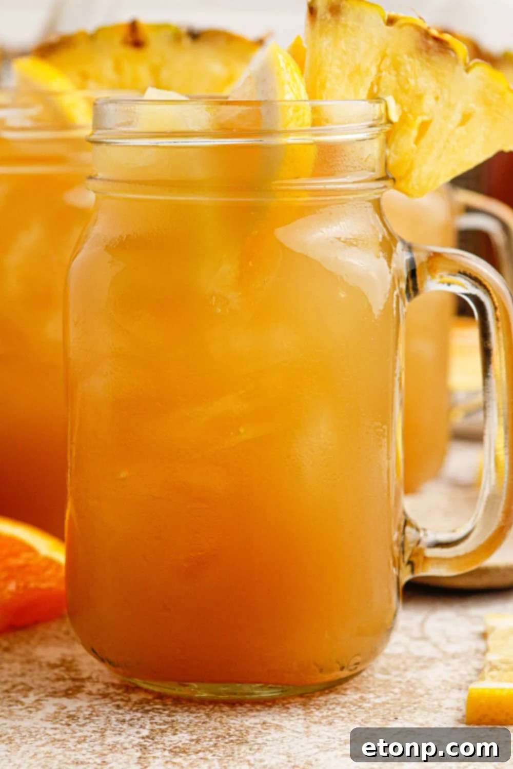 Twisted tea with bourbon in glasses, garnished with citrus
