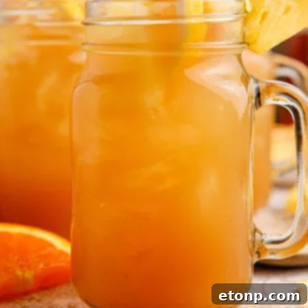 Touchdown Tea in a mason jar garnished with fruit