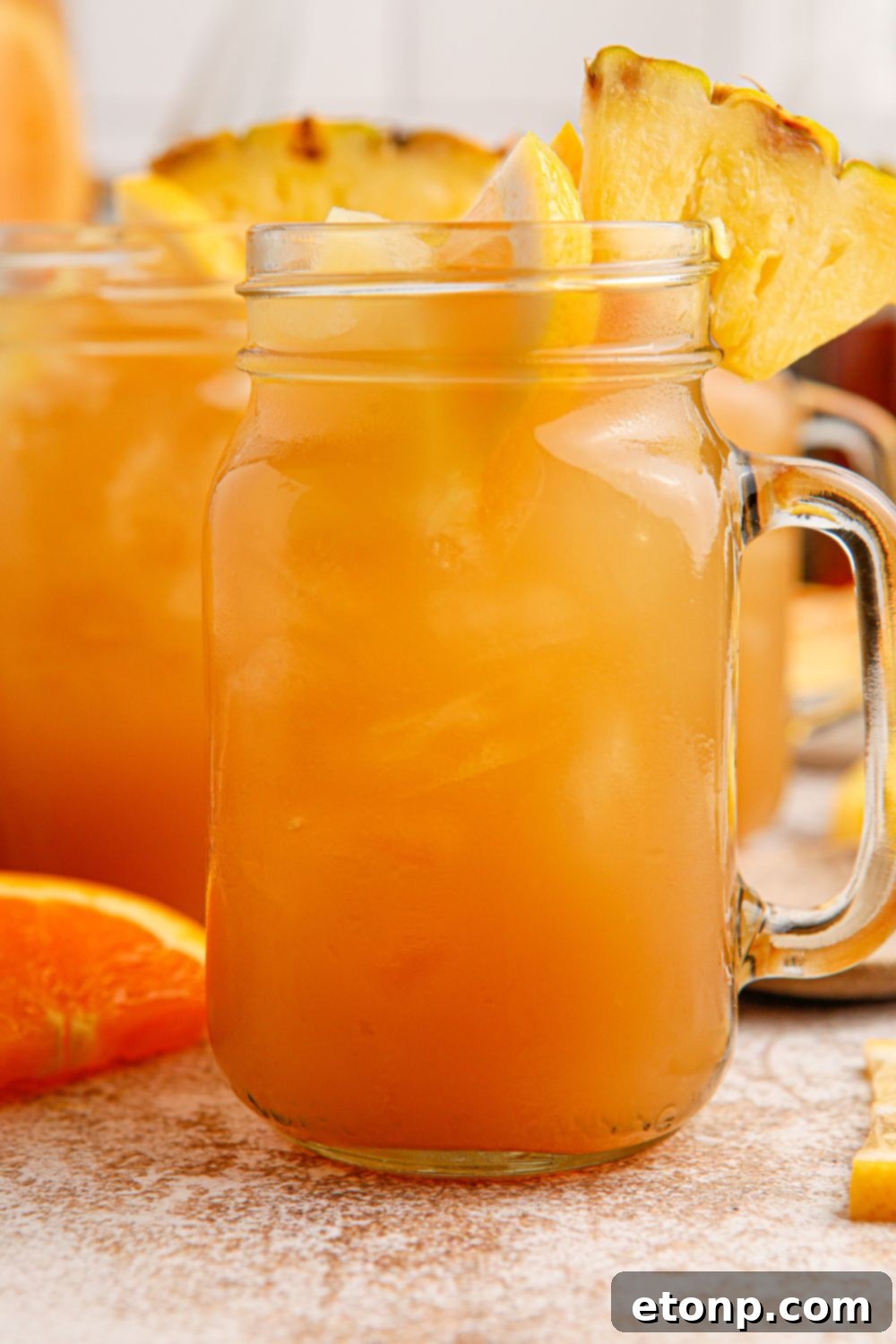 Touchdown Tea served in a mason jar, garnished with vibrant fruit slices