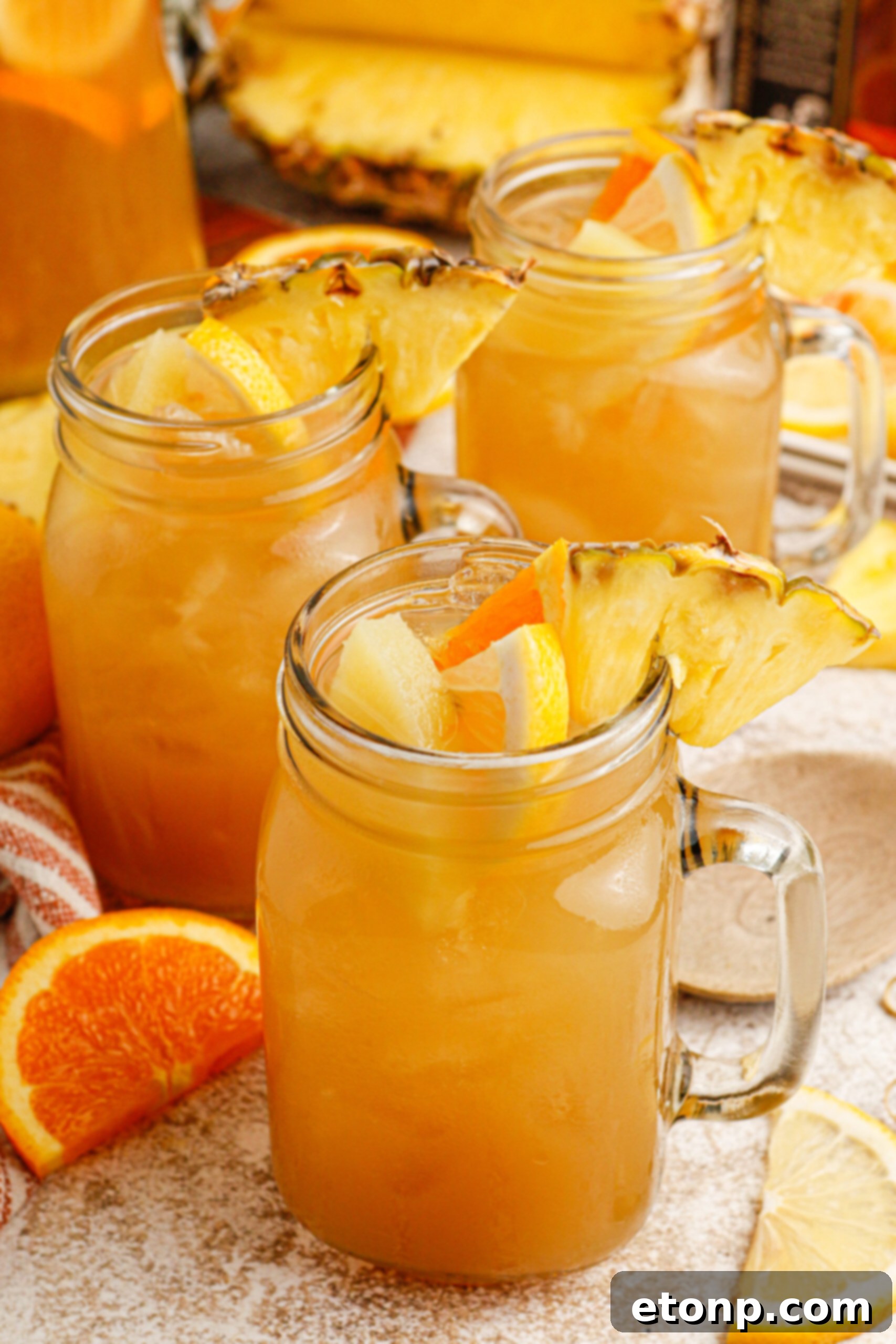 Touchdown Tea in a large glass pitcher, filled with ice and fruit