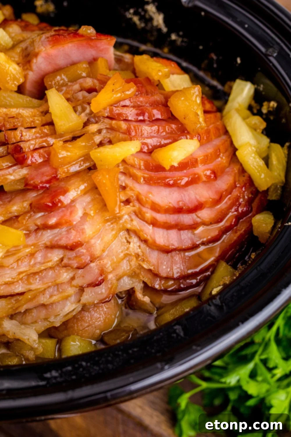side view of ham in a slow cooker