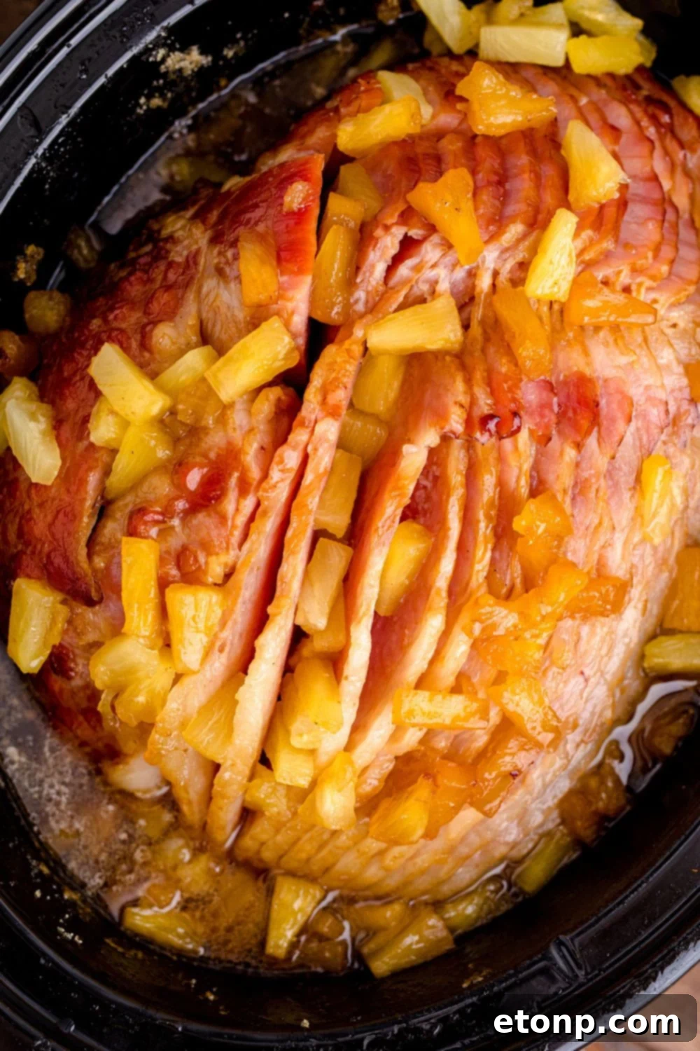 overhead shot of ham and pineapple in crockpot
