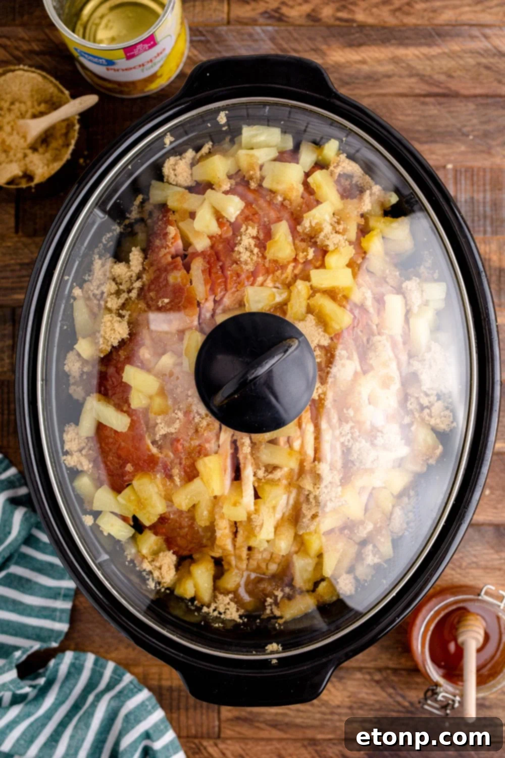 ham in a slow cooker with a lid on it