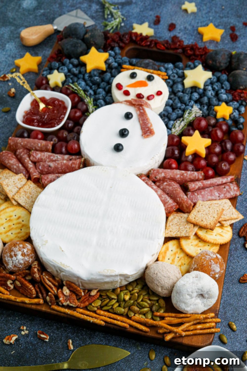 Whimsical Snowman Snack Board 15 Side view of a serving tray featuring the festive snowman charcuterie board, ready for guests.