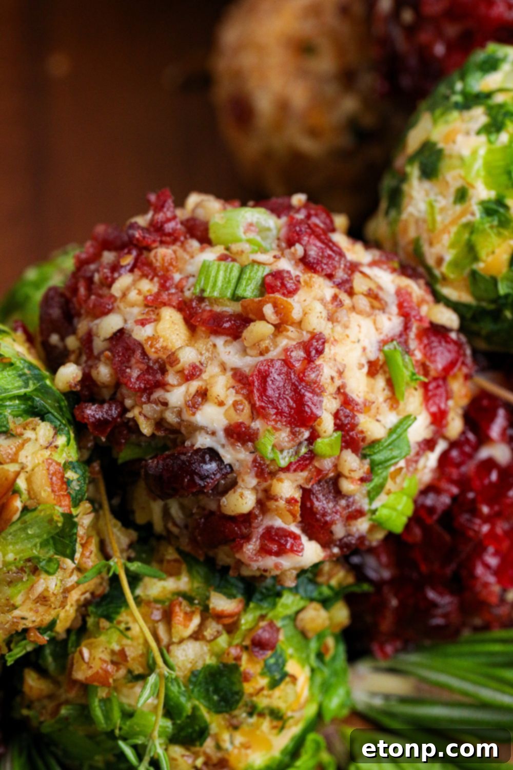 close up of cheese balls stacked on wooden table 