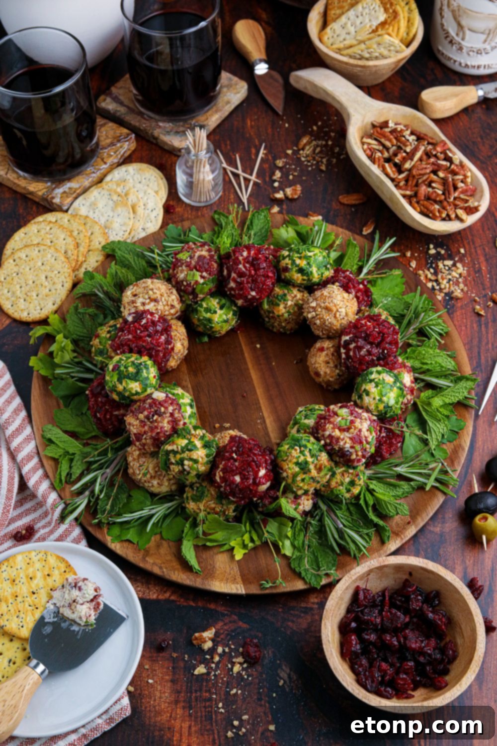 wreath shaped appetizer on table with food all around it 