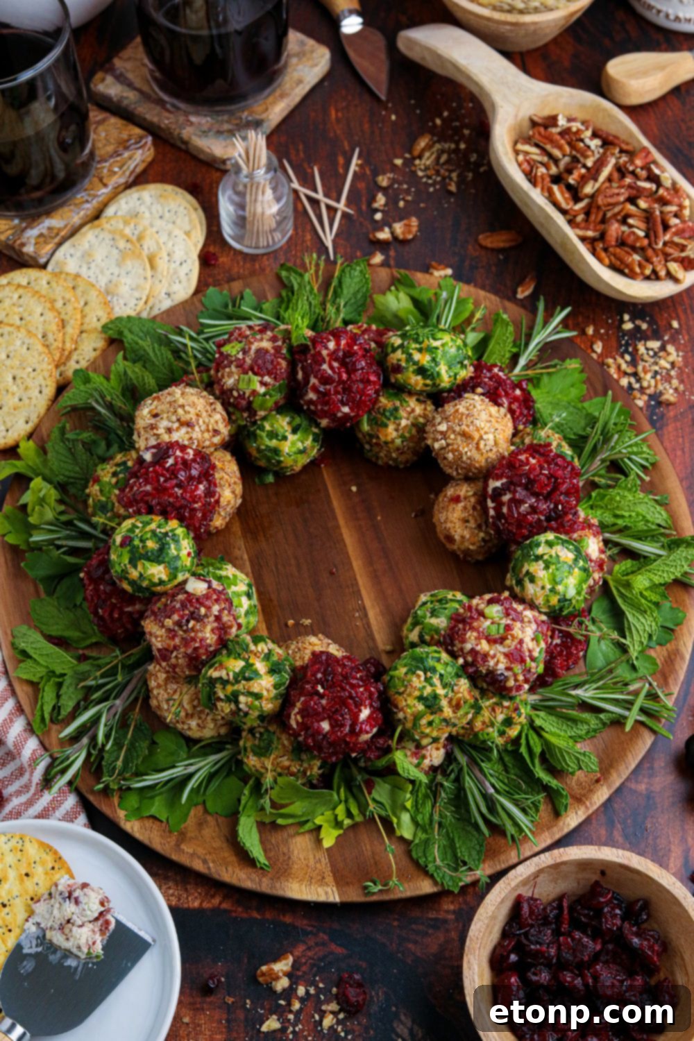 christmas cheeseballs on round cutting board