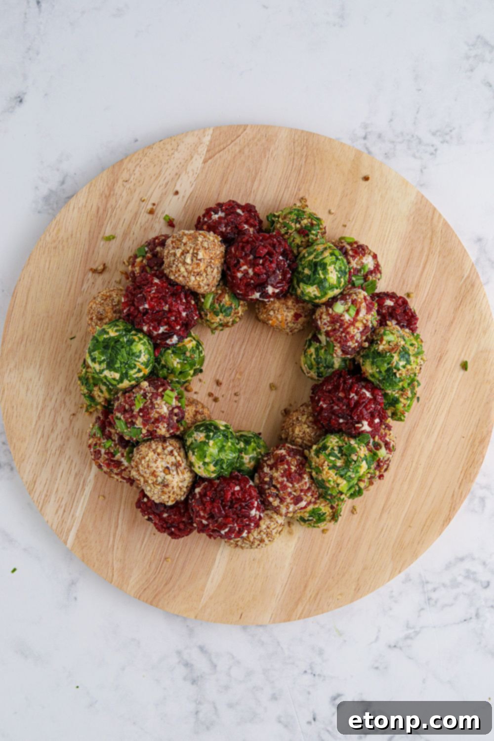 round board with cheeseballs shaped in a round shape