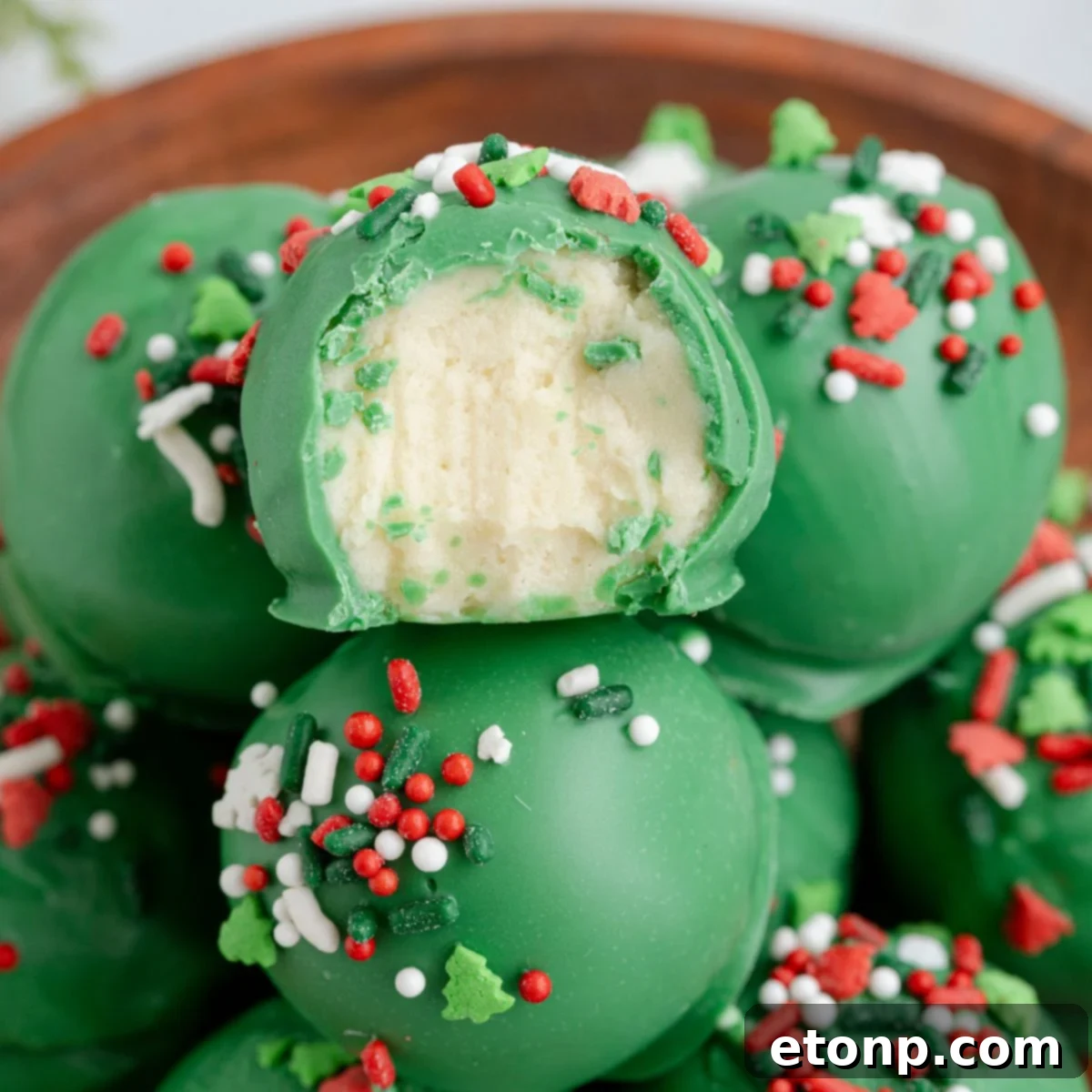Lofthouse Christmas Truffles in a bowl with one has a bite taken out of it 