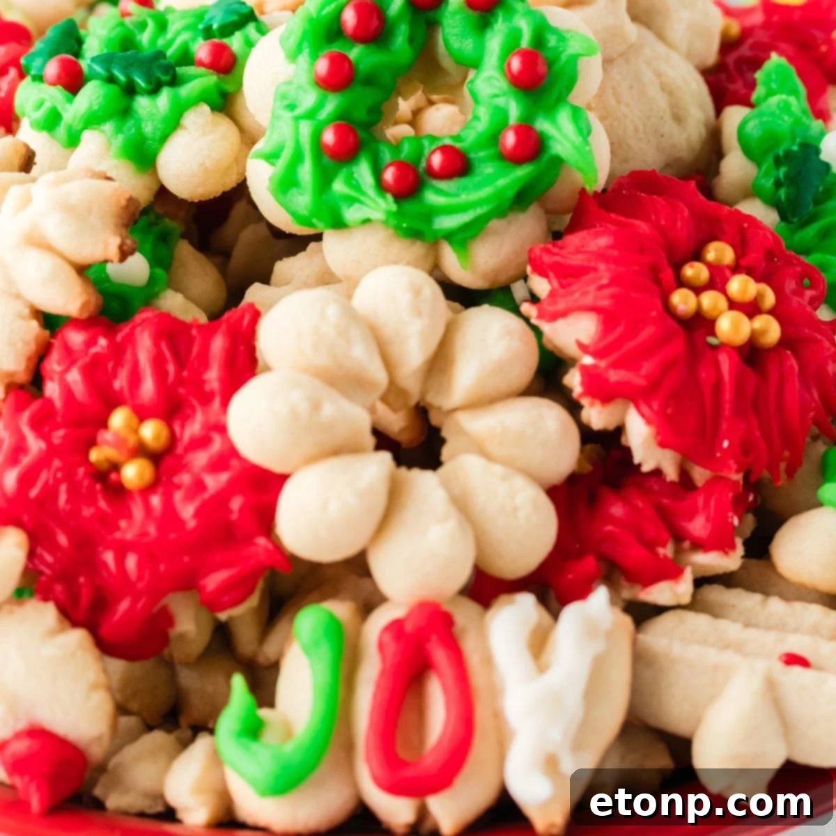 Christmas Spritz Cookies stacked on platter