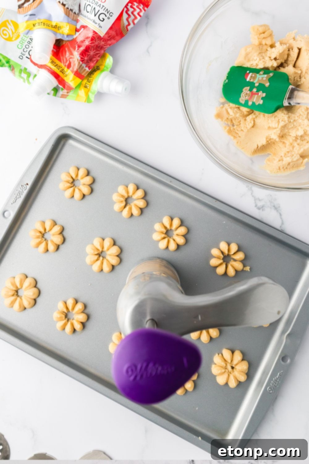 spritz cookies on baking sheet