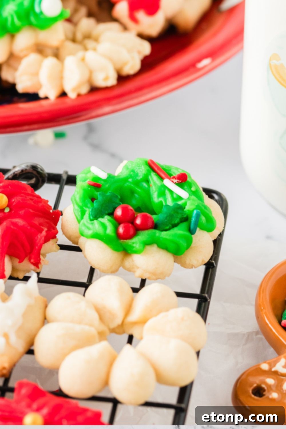 Christmas Spritz Cookies on a cookie tray on table