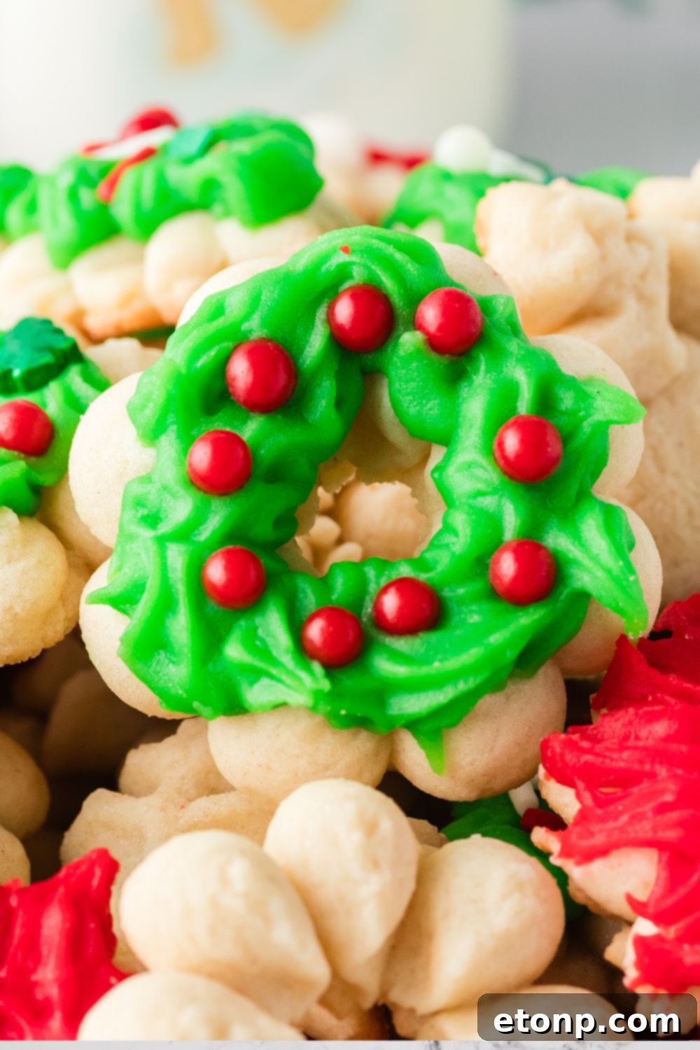Spritzer cookies shaped and placed on table