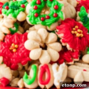 Christmas Spritz Cookies stacked on platter