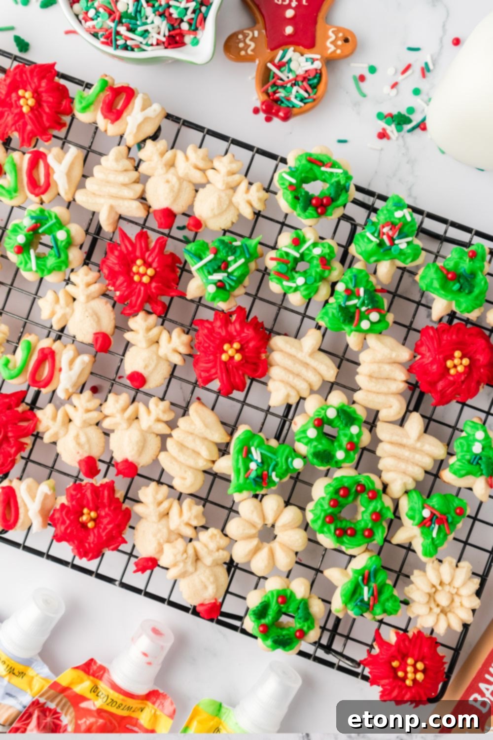 spritz cookies on baking rack on table