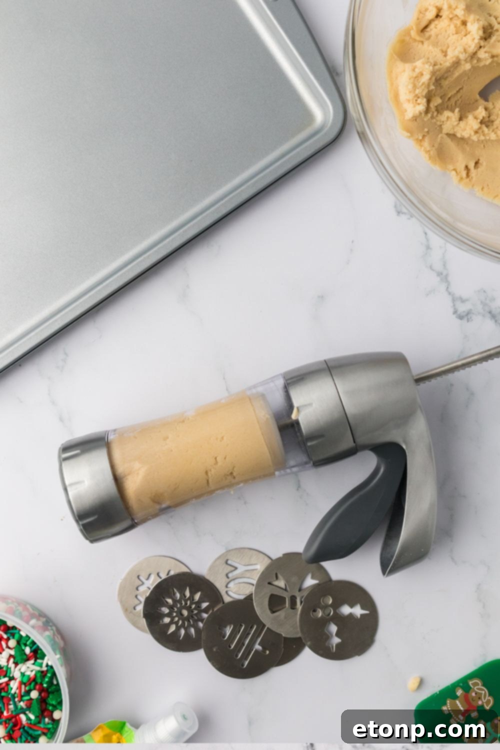 cookie press with cookie dough in it