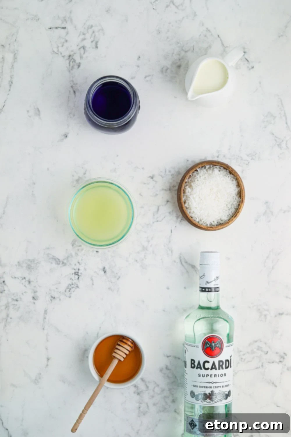 ingredients for cocktail in glass bowls on table