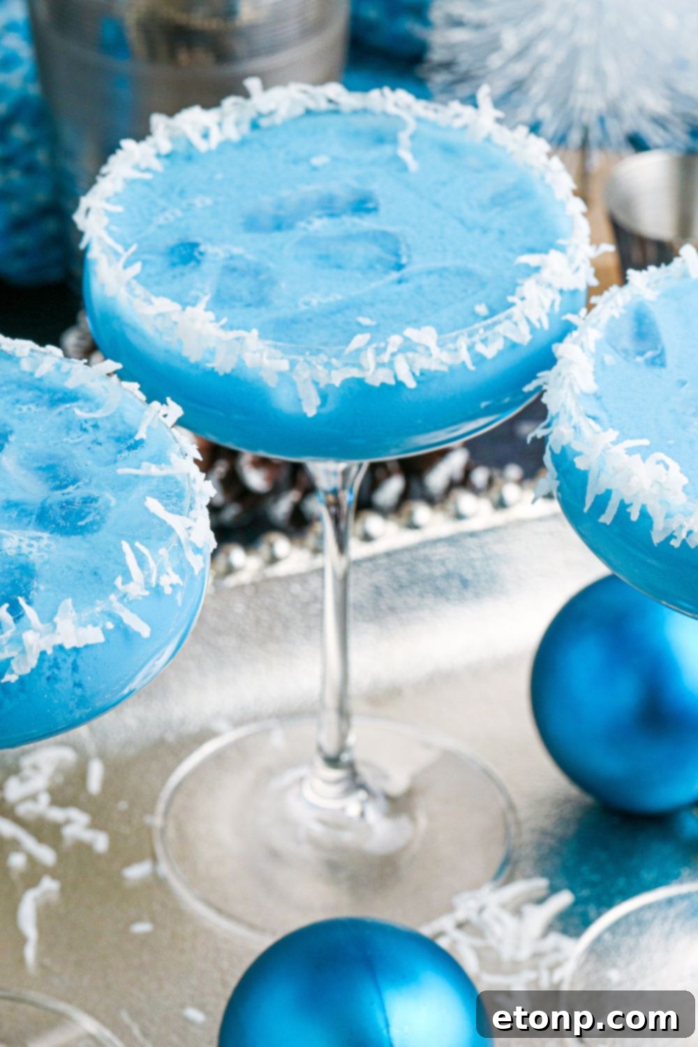 glasses on platter with blue cocktail in them