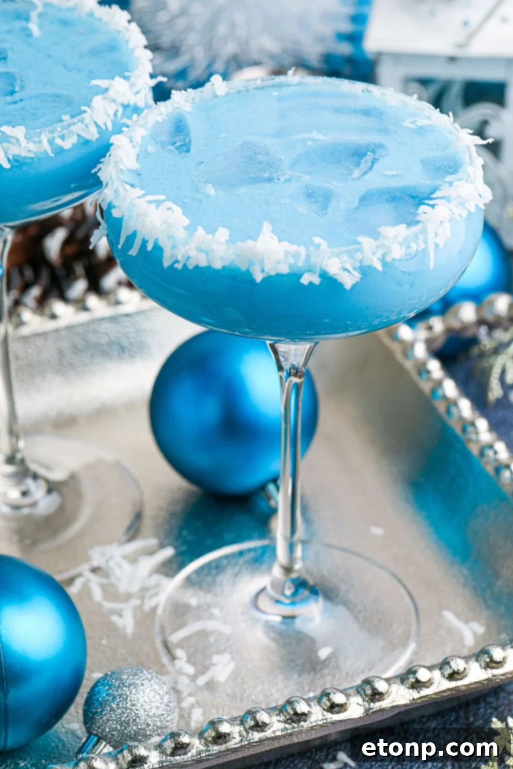 cocktail with christmas ornaments around the plater