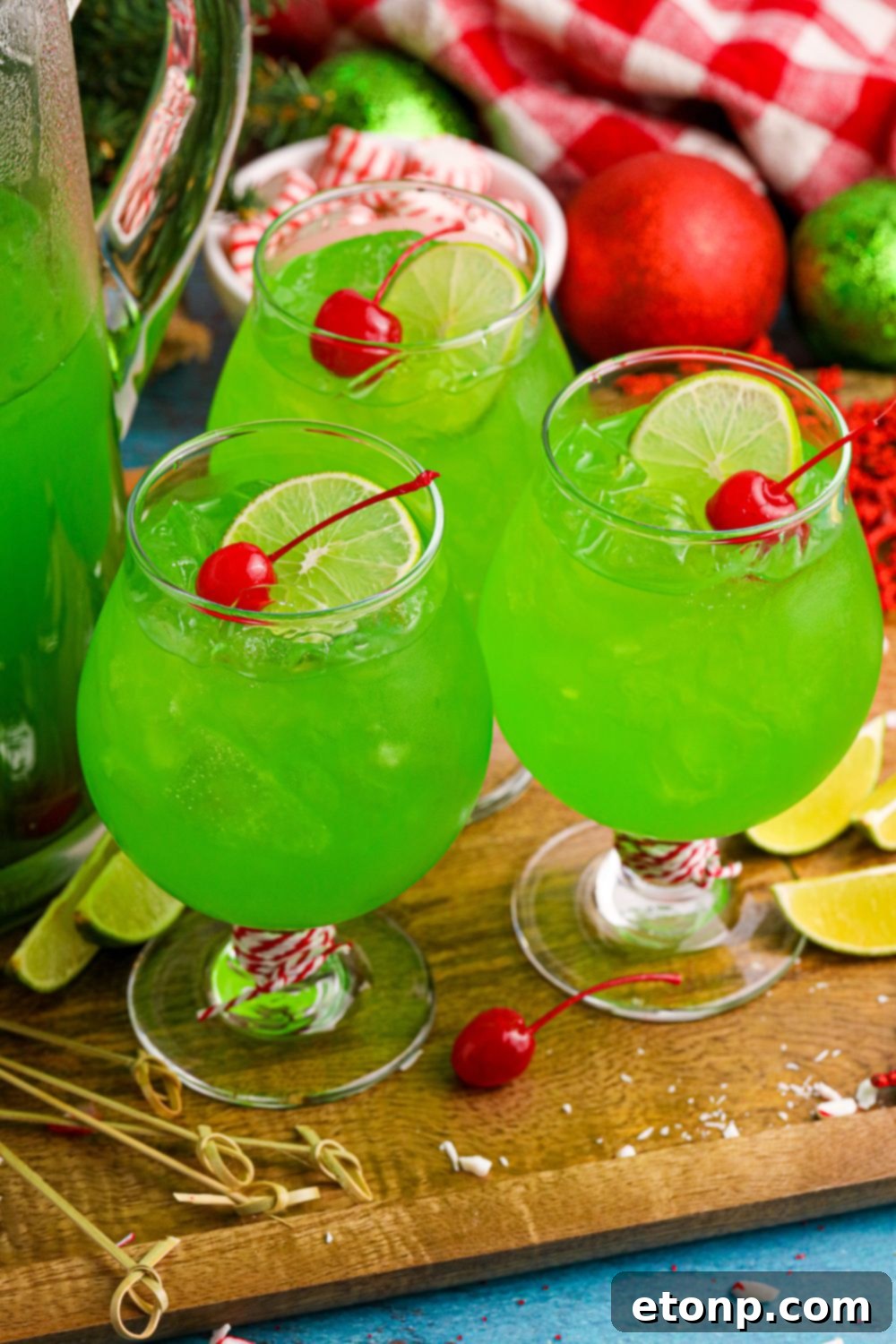 Multiple glasses of Christmas punch arranged on a table, showcasing the vibrant holiday drink.