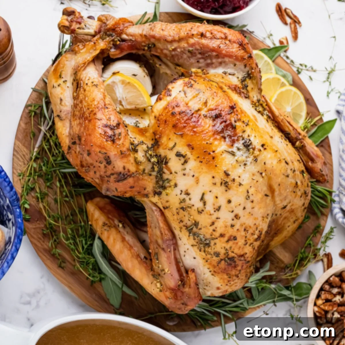 whole roasted turkey on a platter on table