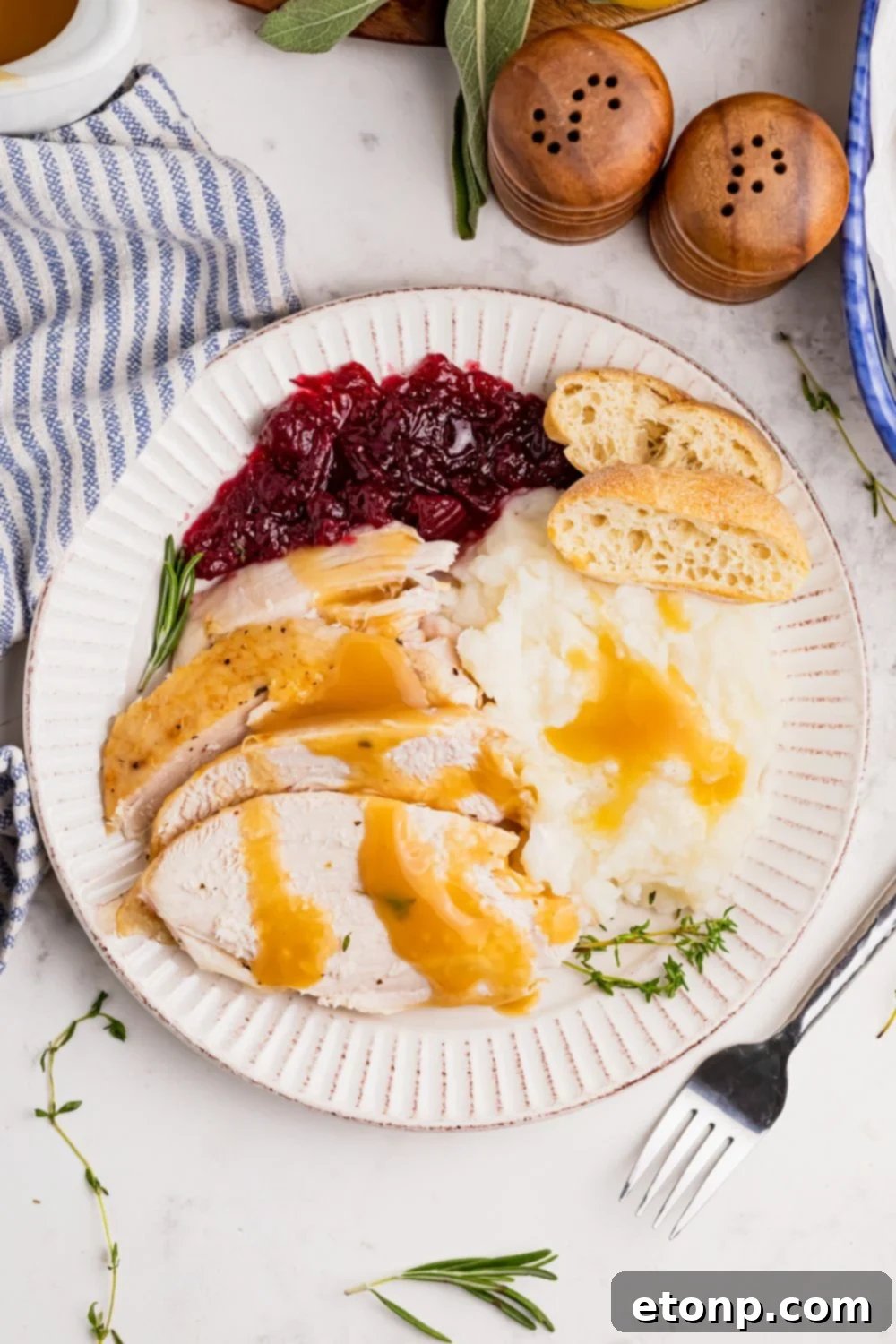 overhead plate with turkey and mashed potatoes and more on table