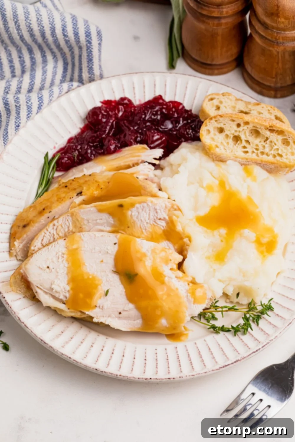roasted turkey on table with food around it
