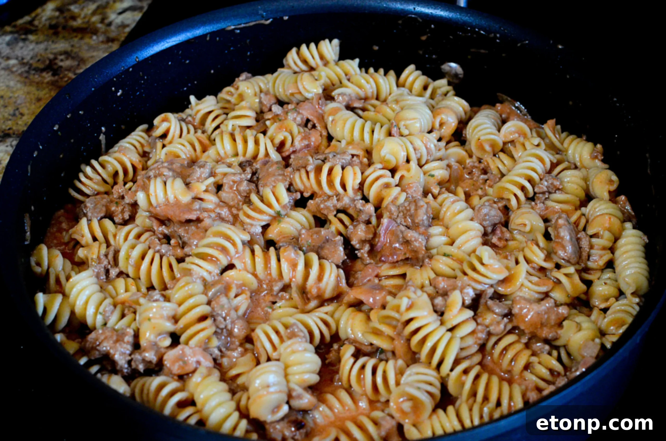 Ingredients being mixed in a large pot