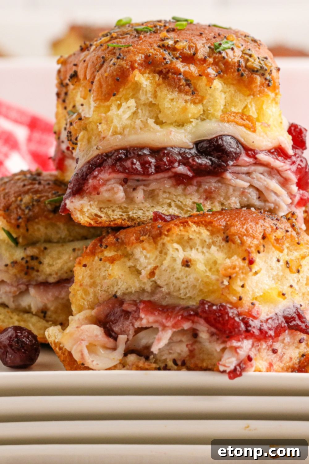 Festive Turkey Sliders 20 sliders stacked on top of each other on plate