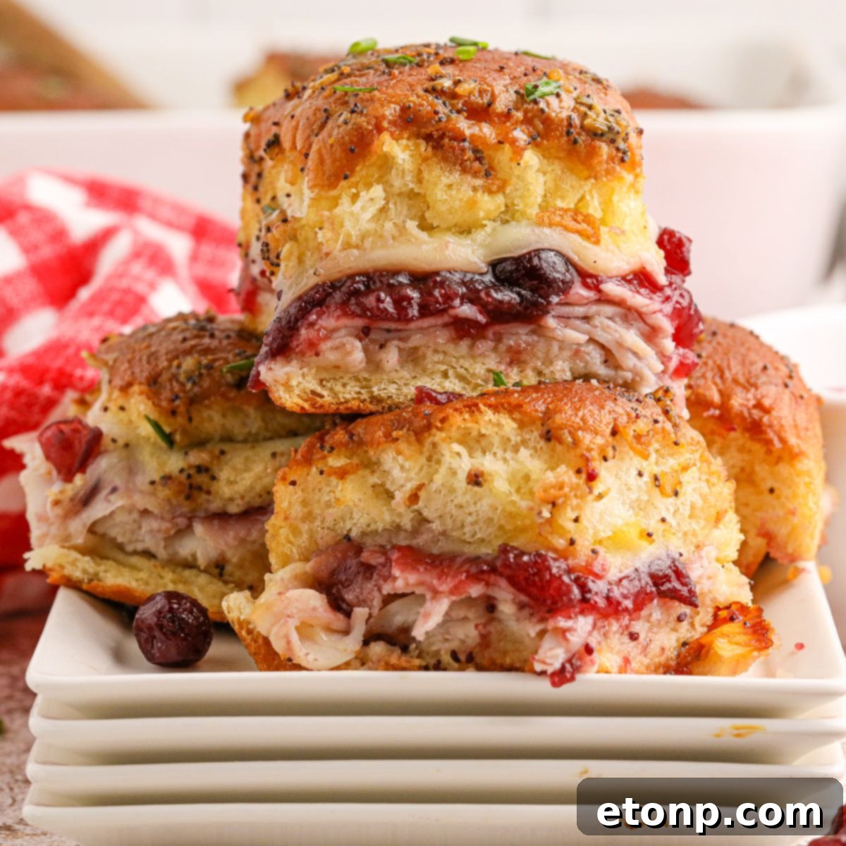 Festive Turkey Sliders 3 Thanksgiving Sliders stacked on plates on table
