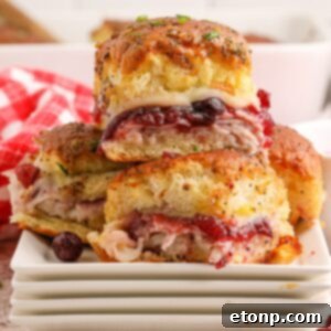 Thanksgiving Sliders stacked on plates on table